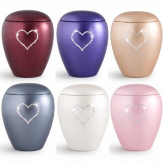 Perlmuttfarbene Keramiktierurne aus der Edition Crystal mit handgefertigtem Herz aus funkelnden Kristallen